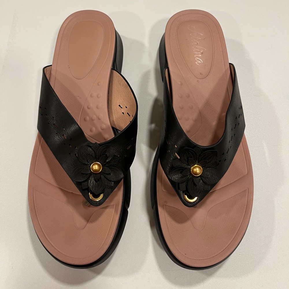 Black and Pink Women's flip flop sandals with gold flower accent